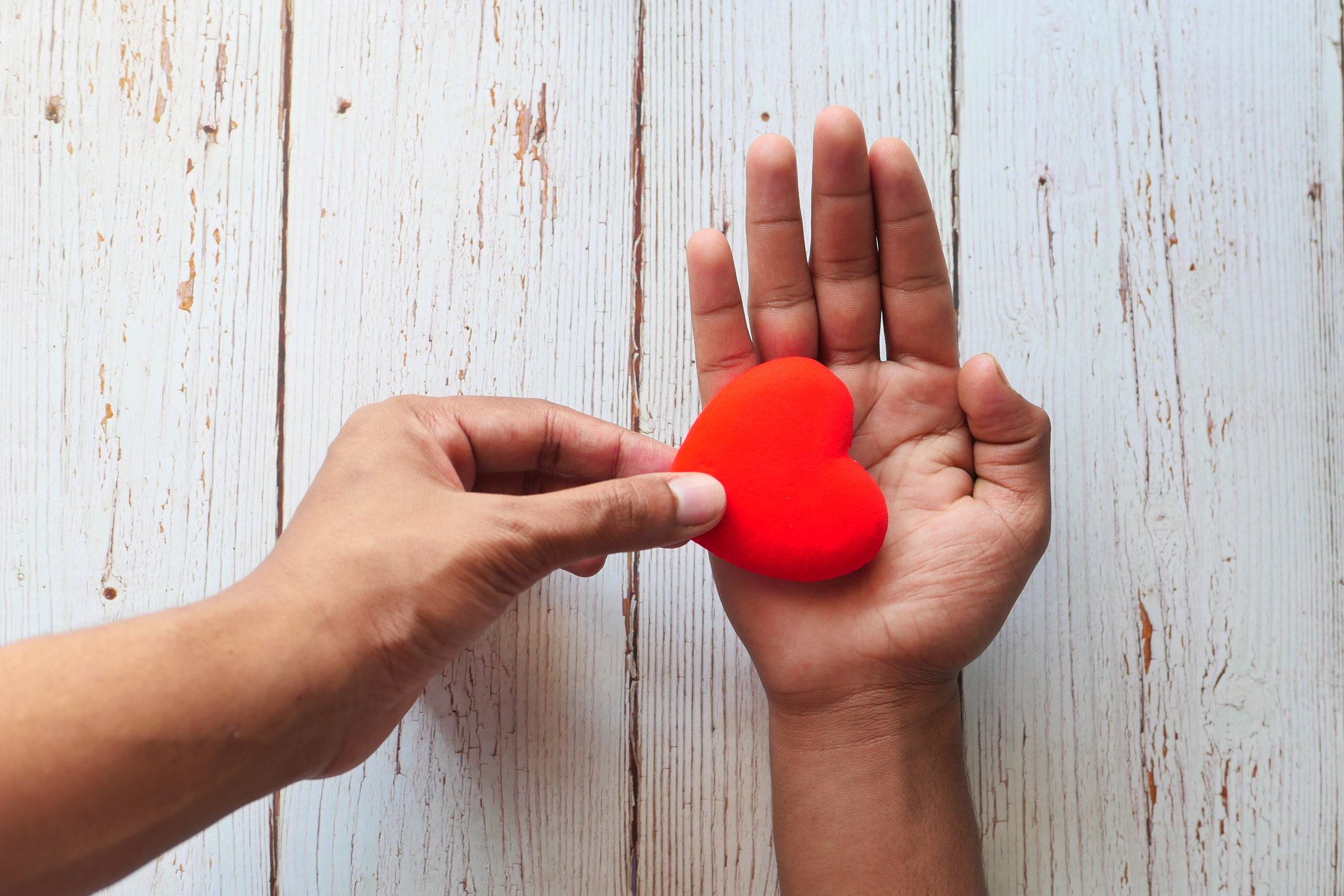 Man Hand with Heart on White Background. the Concept of Take Care of Health